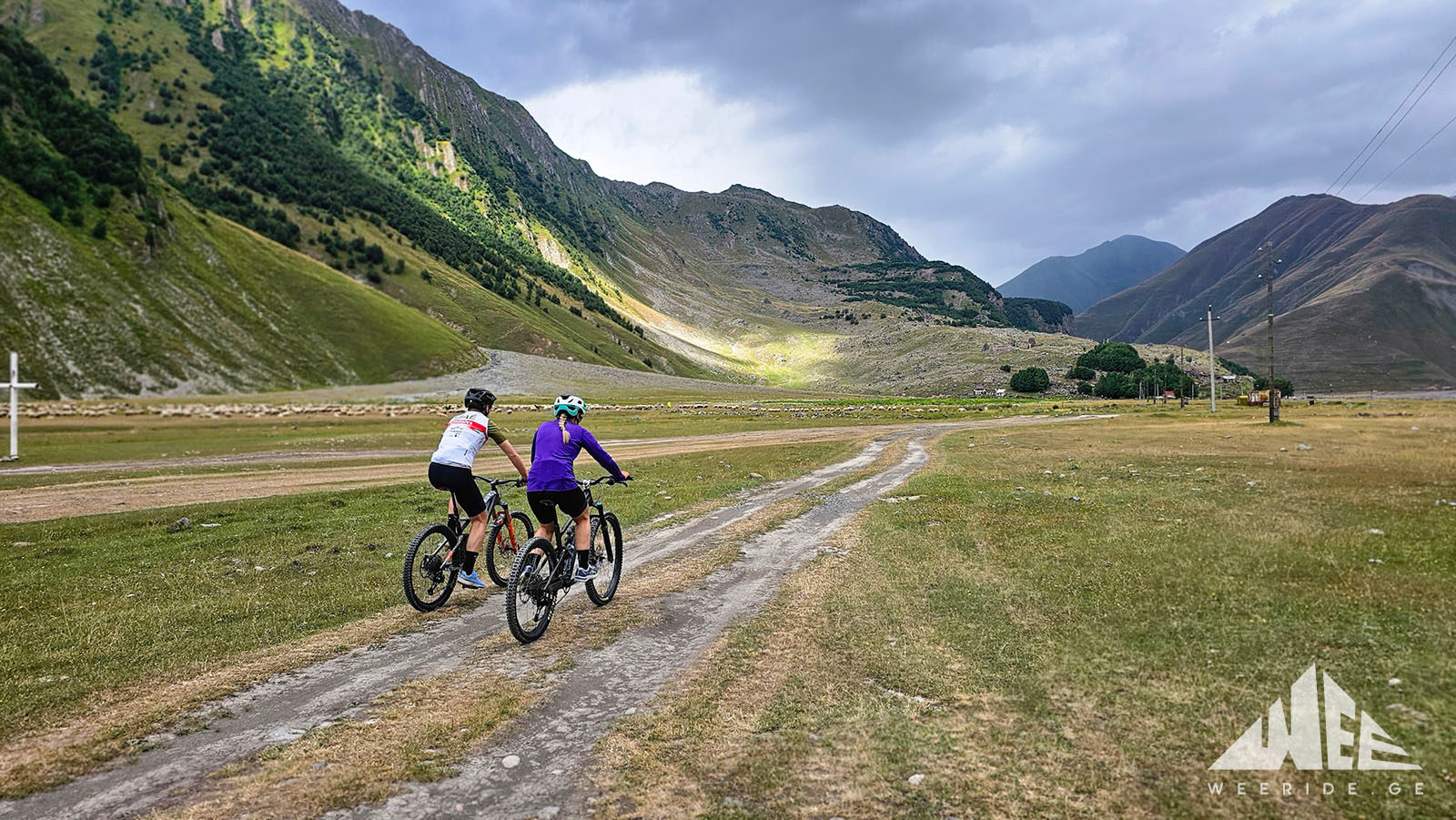 E-bike and MTB riders exploring Khada Gorge in Kazbegi, Georgia