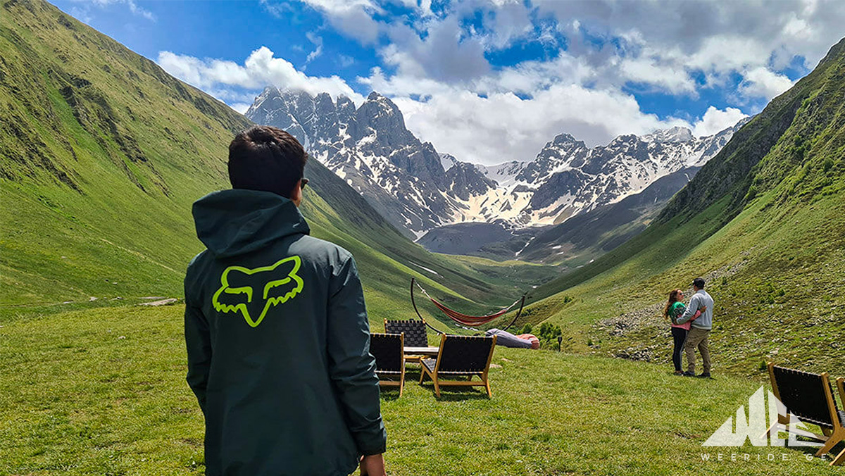 Rider enjoying the view of the Chaukhi Mountains on a Kazbegi E-bike tour