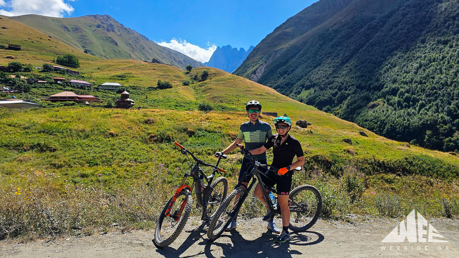 E-bike riders on the Sno to Juta trail with views of the Chaukhi Mountains in Kazbegi, Georgia